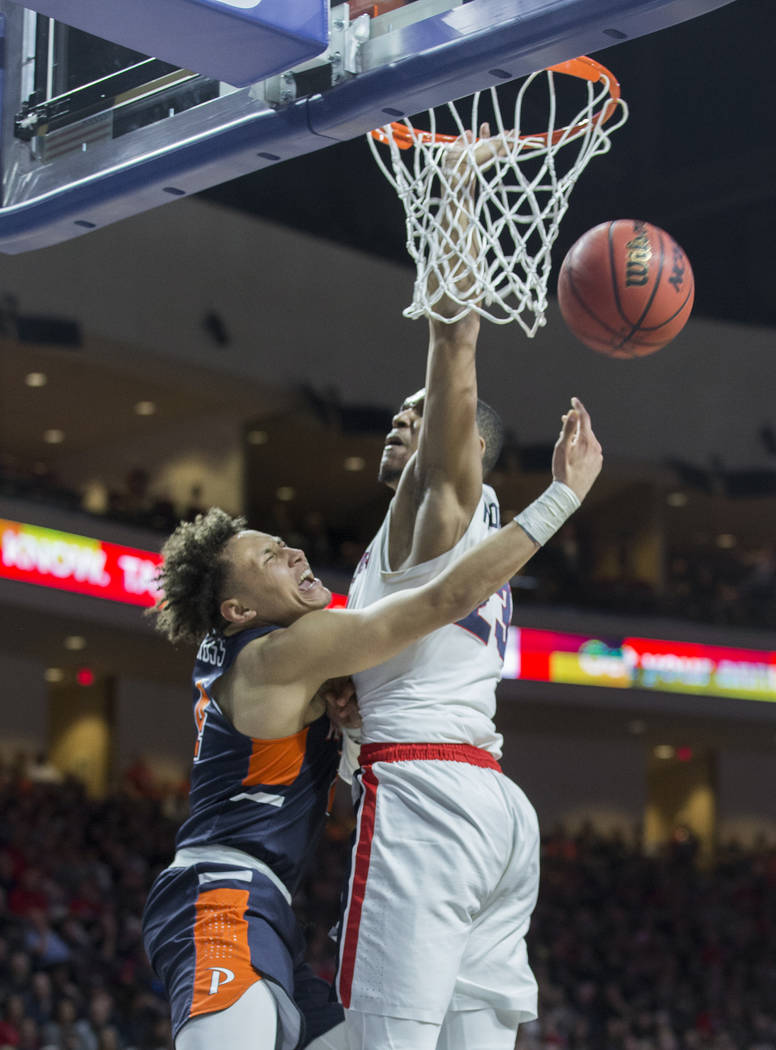 Pepperdine sophomore guard Colbey Ross (4) gets fouled by Gonzaga sophomore guard Zach Norvell Jr. (23) in the second half during the West Coast Conference semifinal game on Monday, March 11, 2019 ...