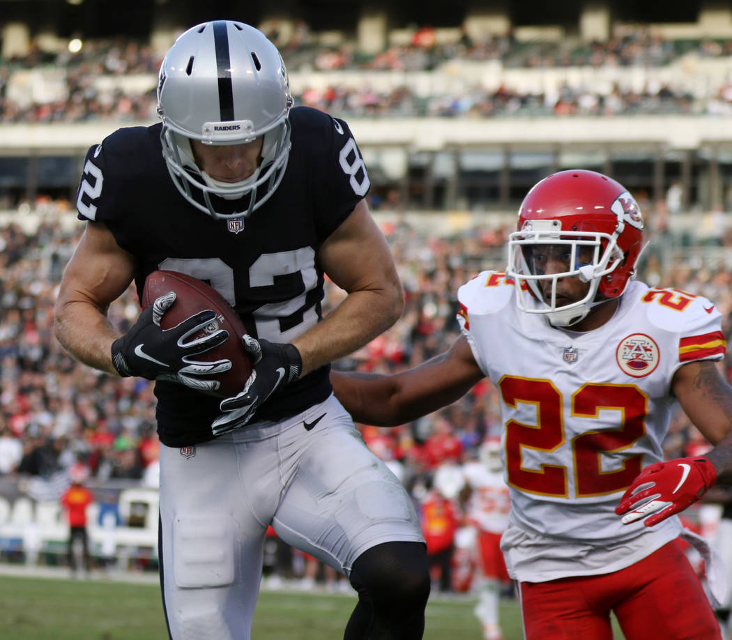 Oakland Raiders wide receiver Jordy Nelson (82) catches a pass over Kansas City Chiefs defensive back Orlando Scandrick (22) during the second half of an NFL game in Oakland, Calif., Sunday, Dec. ...