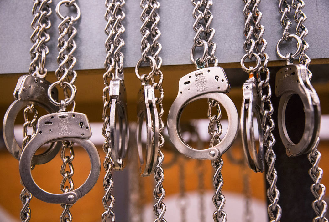 A row of handcuffs hang at the Metro Traffic Bureau during a Metro "DUI blitz" event on Thursday, March 14, 2019, in Las Vegas. (Benjamin Hager Review-Journal) @BenjaminHphoto