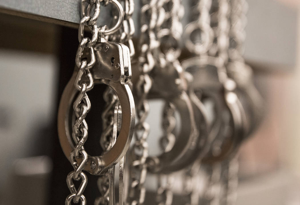 A row of handcuffs hang at the Metro Traffic Bureau during a Metro "DUI blitz" event on Thursday, March 14, 2019, in Las Vegas. (Benjamin Hager Review-Journal) @BenjaminHphoto