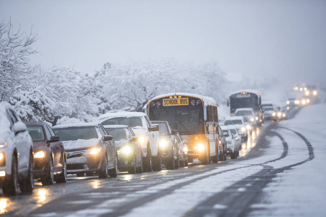 Traffic is backed up in heavy snow near Centennial High School on Thursday, Feb. 21, 2019, in Las Vegas. (Benjamin Hager Review-Journal) @BenjaminHphoto