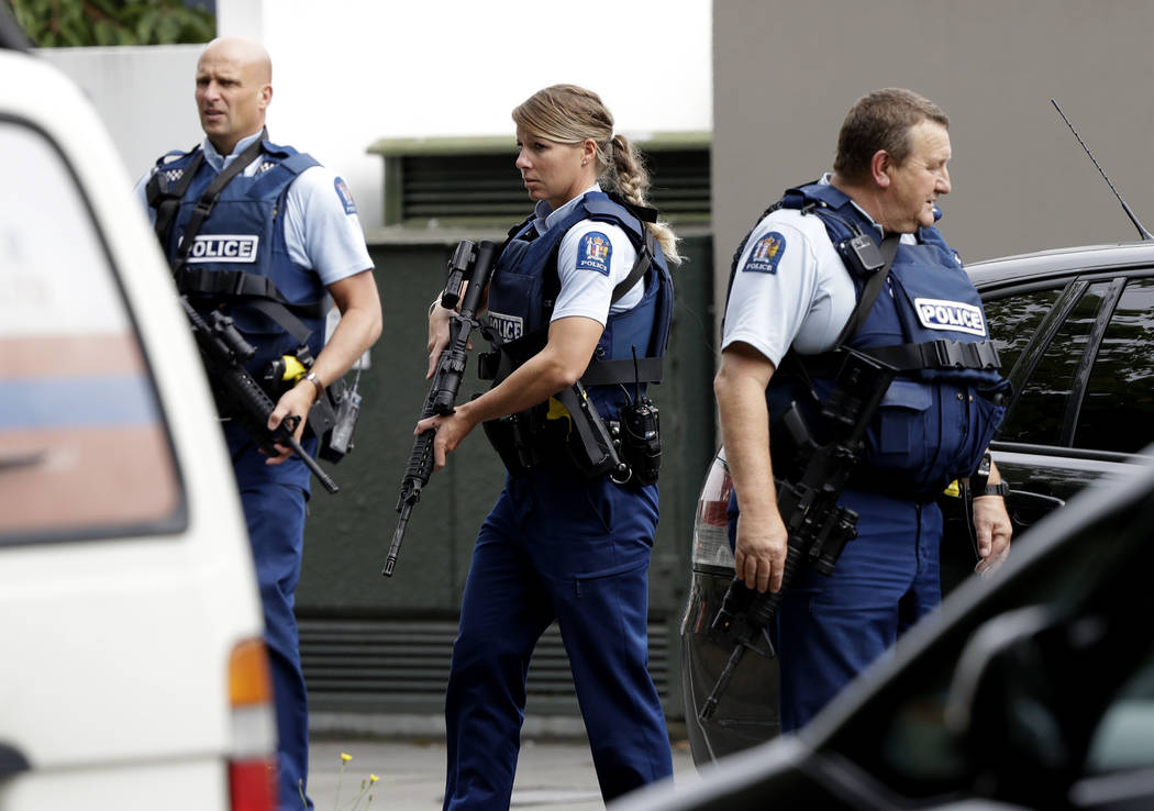 Armed police patrol outside a mosque in central Christchurch, New Zealand, Friday, March 15, 2019. (AP Photo/Mark Baker)