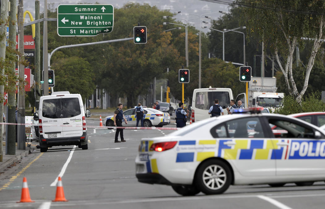 Police block the road near the shooting at a mosque in Linwood, Christchurch, New Zealand, Friday, March 15, 2019. Multiple people were killed during shootings at two mosques full of people attend ...