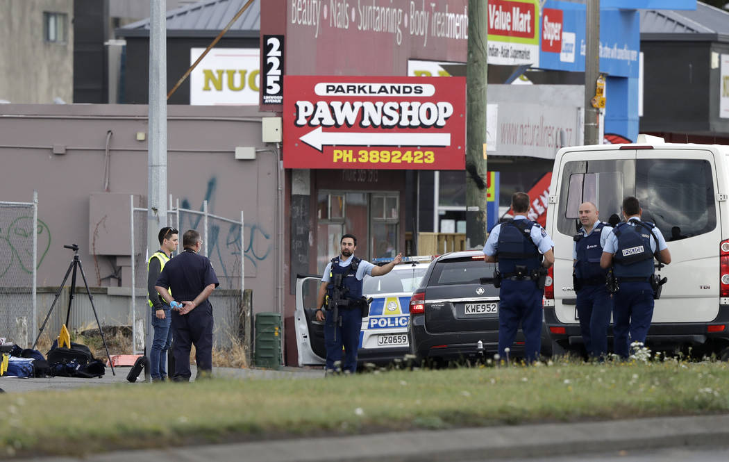 Police stand outside a mosque in Linwood, Christchurch, New Zealand, Friday, March 15, 2019. Multiple people were killed during shootings at two mosques full of people attending Friday prayers. (A ...