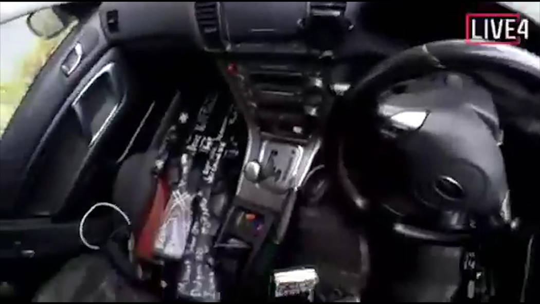 This image taken from the alleged shooter’s video, which was filmed Friday, March 15, 2019, guns on the passenger side of his vehicle in New Zealand. A witness says many people have been ki ...