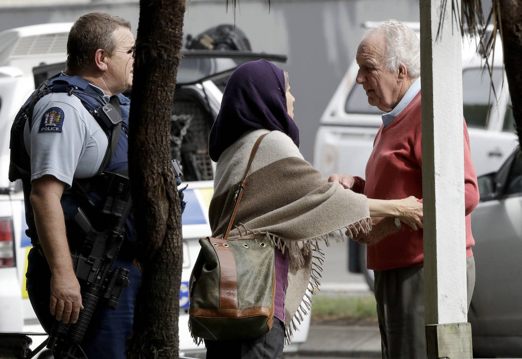 Police escort people away from outside a mosque in central Christchurch, New Zealand, Friday, March 15, 2019. Multiple people were killed in mass shootings at two mosques full of people attending ...