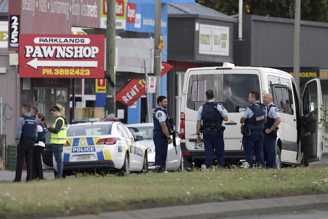 Police stand outside a mosque in Linwood, Christchurch, New Zealand, Friday, March 15, 2019. Multiple people were killed during shootings at two mosques full of people attending Friday prayers. (A ...