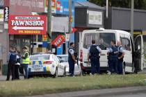 Police stand outside a mosque in Linwood, Christchurch, New Zealand, Friday, March 15, 2019. Multiple people were killed during shootings at two mosques full of people attending Friday prayers. (A ...