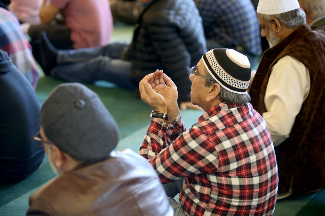Worshipers listen to Shaykh Obair Katchi, imam of Corona Masjid in California, during a prayer service at the Mosque of Islamic Society of Nevada in Las Vegas Friday, March 15, 2019. (K.M. Cannon/ ...