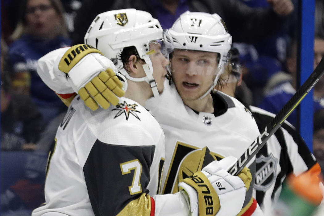 Vegas Golden Knights left wing Valentin Zykov (7) celebrates his goal against the Tampa Bay Lightning with center William Karlsson during the third period of an NHL hockey game Tuesday, Feb. 5, 20 ...