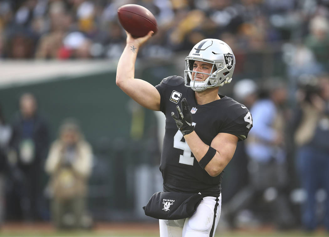 Oakland Raiders quarterback Derek Carr (4) passes against the Pittsburgh Steelers during the second half of an NFL football game in Oakland, Calif., Sunday, Dec. 9, 2018. (AP Photo/Ben Margot)