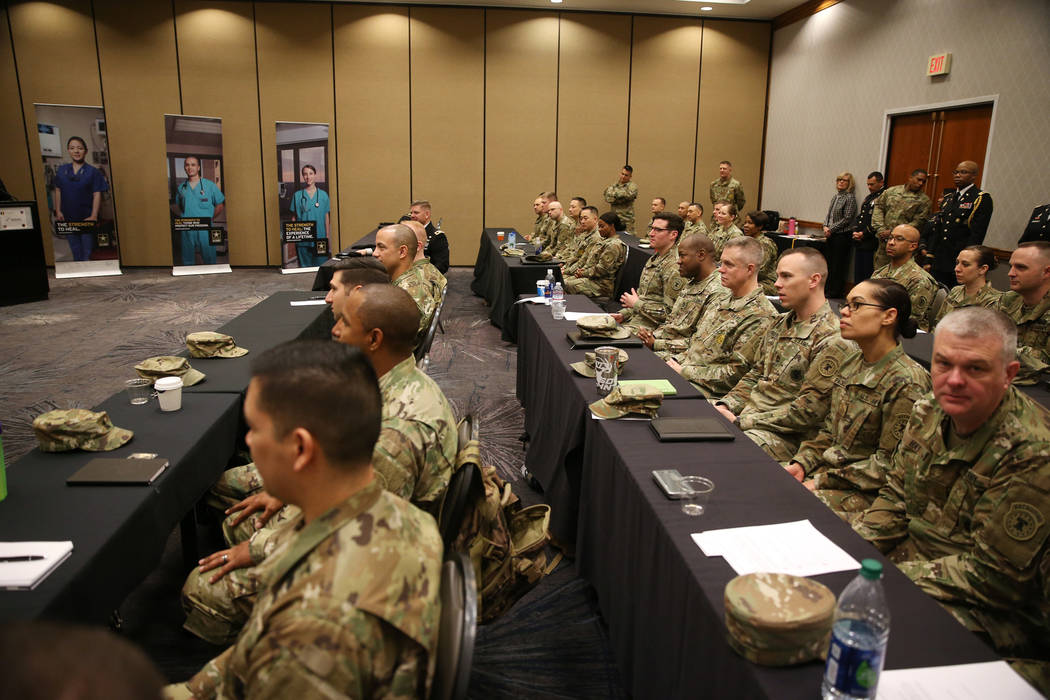 Members of the military was as Anthony Hua is sworn in as U.S. Army Reserve captain during a ceremony at the Hampton Inn Tropicana and Event Center in Las Vegas, Friday, March 15, 2019. Hua is a g ...