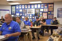 International Plastic Modelers Society members of the Las Vegas chapter sit in a group meeting ...