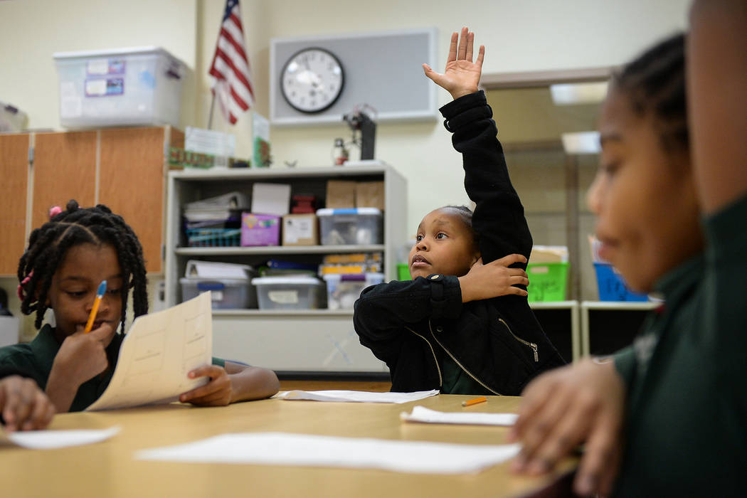 Geleah Sessoms raises her hand in her class at Rainbow Dreams Academy in Las Vegas, Tuesday, Jan. 15, 2019. (Caroline Brehman/Las Vegas Review-Journal)