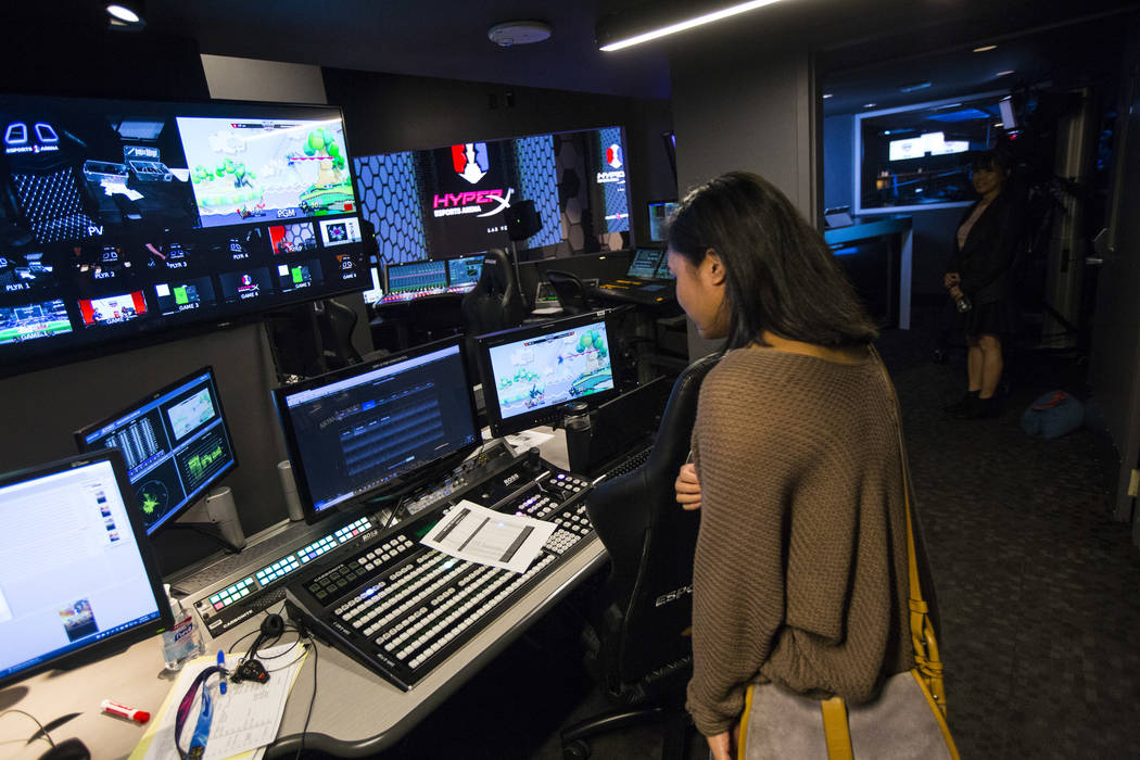 Grant recipient Alexandra de la Cruz explores the production room during a visit to the HyperX Esports Arena at the Luxor as part of the 1,000 Dreams Fund's BroadcastHER Academy Challenge in Las V ...