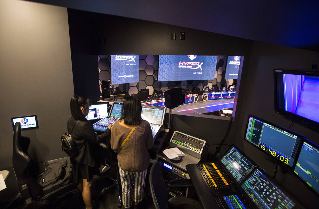 Grant recipients Obe Wan, left, and Alexandra de la Cruz explore the production room during a visit to the HyperX Esports Arena at the Luxor as part of the 1,000 Dreams Fund's BroadcastHER Academy ...