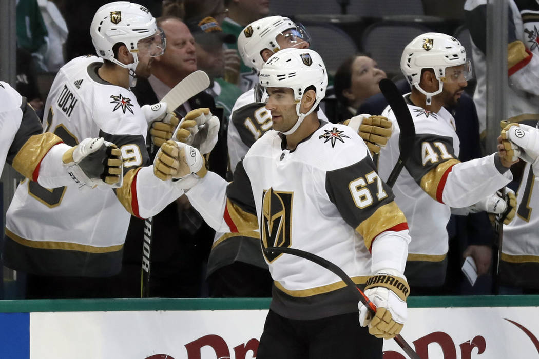 Vegas Golden Knights left wing Max Pacioretty (67) is congratulated by the bench after scoring against the Dallas Stars in the first period of an NHL hockey game in Dallas, Friday, March 15, 2019. ...