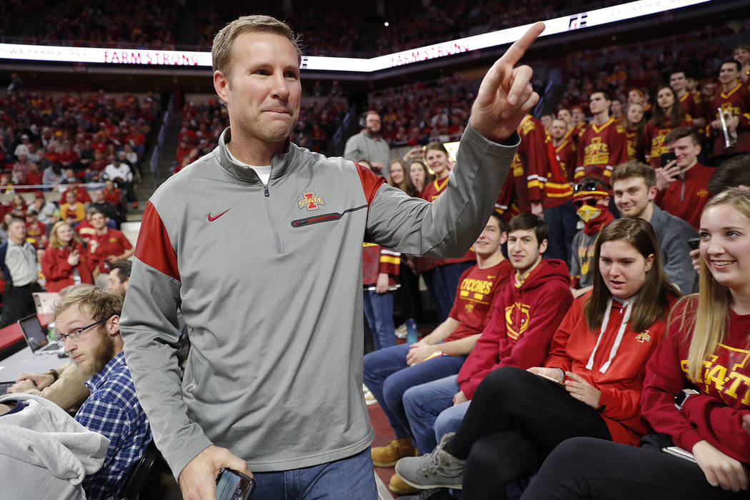 Former Iowa State head coach Fred Hoiberg points to fans as he walks by during the first half of the Iowa State NCAA college basketball game against Baylor, Tuesday, Feb. 19, 2019, in Ames, Iowa. ...