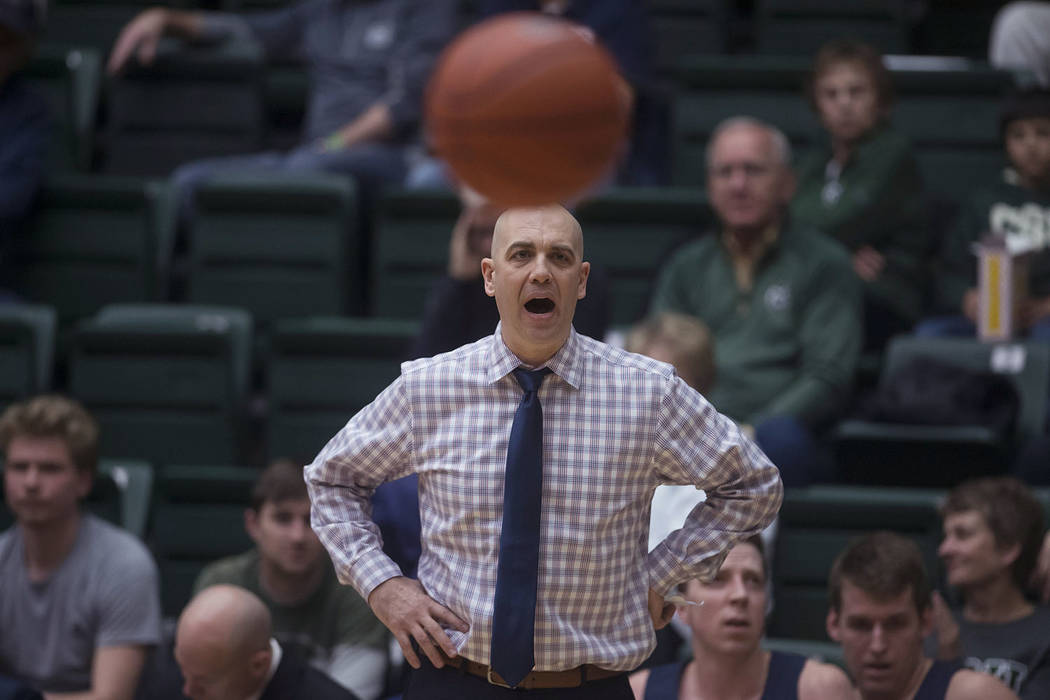 Utah State coach Craig Smith calls out to his team during an NCAA college basketball game against Colorado State on Tuesday, March 5, 2019, in Fort Collins, Colo (Timothy Hurst/The Coloradoan via AP)