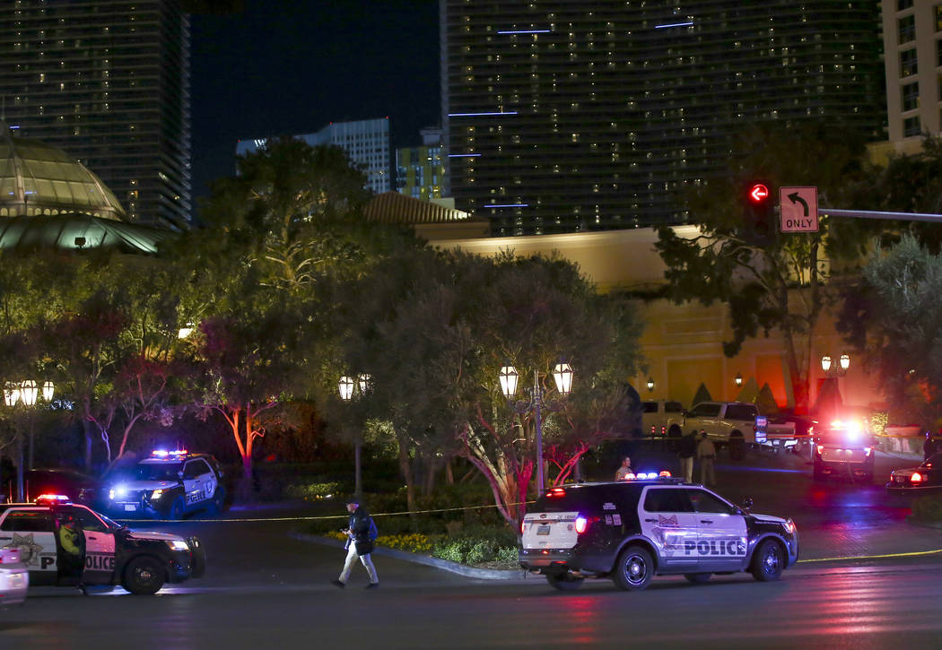 Las Vegas police officers investigate outside of the north valet at the Bellagio after police fired at a robbery suspect in Las Vegas on Friday, March 15, 2019. (Chase Stevens/Las Vegas Review-Jou ...