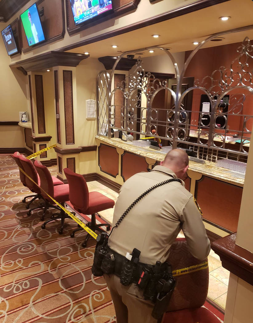 A Las Vegas police officer tapes off an area in the Bellagio after a robbery and officer-involved shooting on March, 15, 2019. (Rick Fuller/Twitter (@gamblindude))