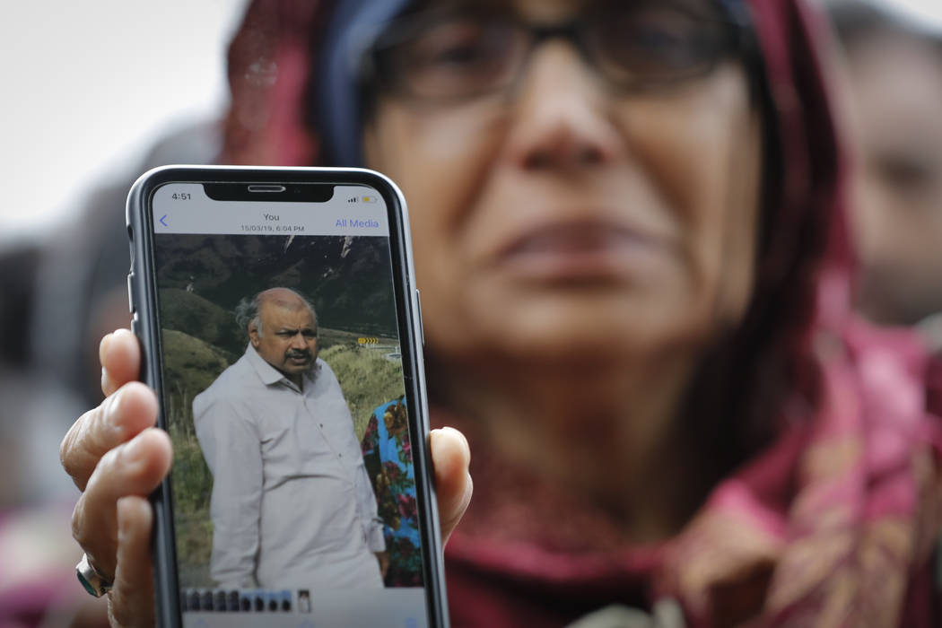Akhtar Khokhur, 58, shows a picture of her missing husband Mehaboobbhai Khokhar during an interview outside an information center for families, Saturday, March 16, 2019, in Christchurch, New Zeala ...