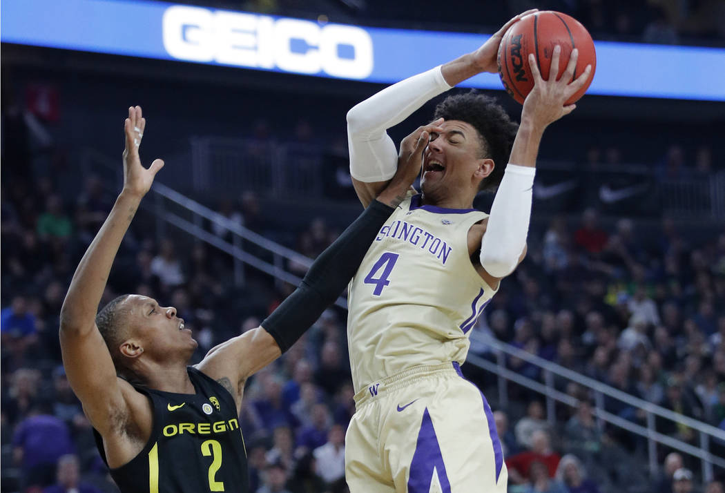 Washington's Matisse Thybulle attempts a shot over Oregon's Louis King during the first half of an NCAA college basketball game in the final of the Pac-12 men's tournament Saturday, March 16, 2019 ...
