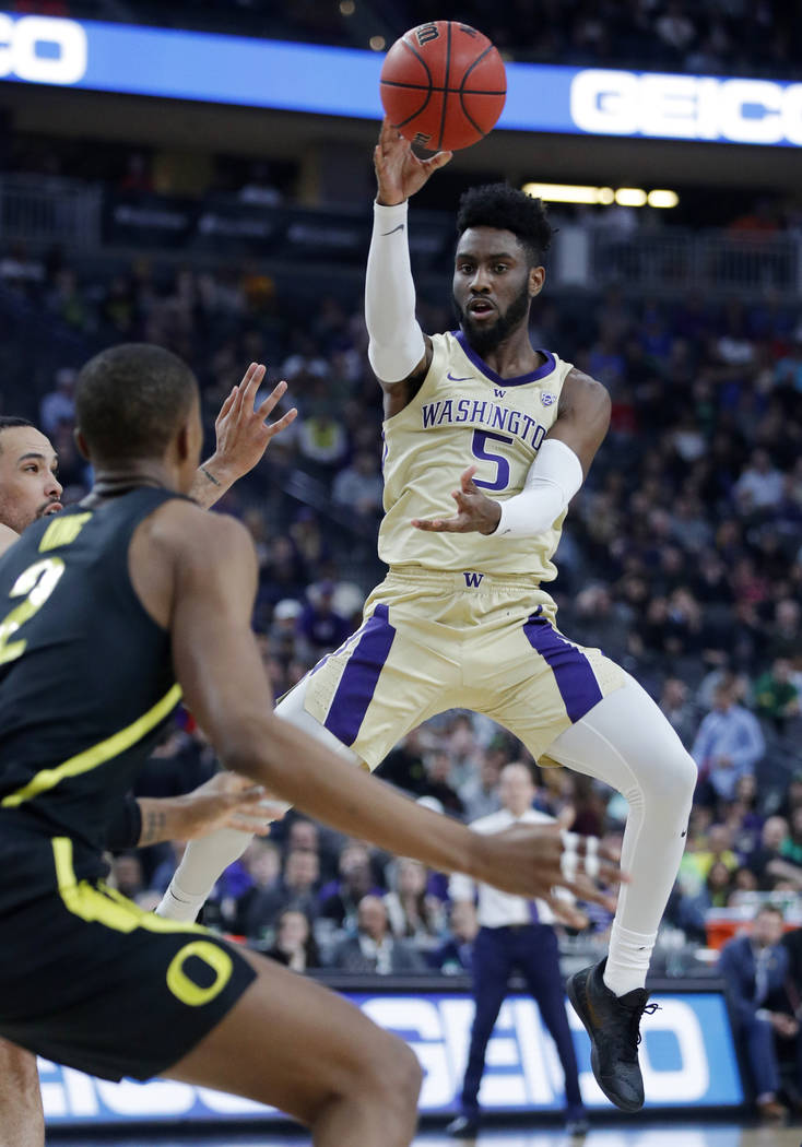 Washington's Jaylen Nowell (5) passes the ball against Oregon during the first half of an NCAA college basketball game in the final of the Pac-12 men's tournament Saturday, March 16, 2019, in Las ...
