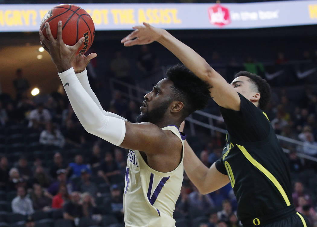 Washington's Jaylen Nowell shoots around Oregon's Will Richardson during the first half of an NCAA college basketball game in the final of the Pac-12 men's tournament Saturday, March 16, 2019, in ...