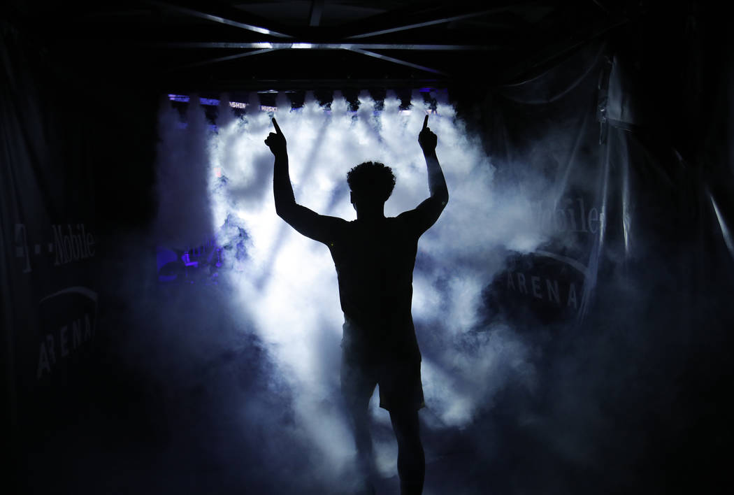 Washington's David Crisp runs onto the court before the team's NCAA college basketball game against Oregon in the final of the Pac-12 men's tournament Saturday, March 16, 2019, in Las Vegas. (AP P ...