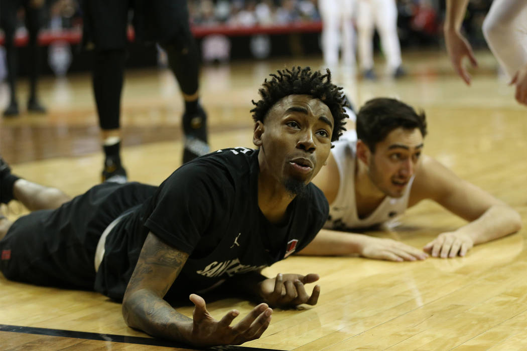 San Diego State Aztecs guard Jeremy Hemsley (42) reacts after loosing the ball out of bounds against Utah State Aggies guard Abel Porter (15) in the second half of the Mountain West tournament men ...
