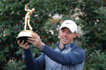 Rory McIlroy, of Northern Ireland, poses with the trophy after winning The Players Championship golf tournament Sunday, March 17, 2019, in Ponte Vedra Beach, Fla. (AP Photo/Gerald Herbert)
