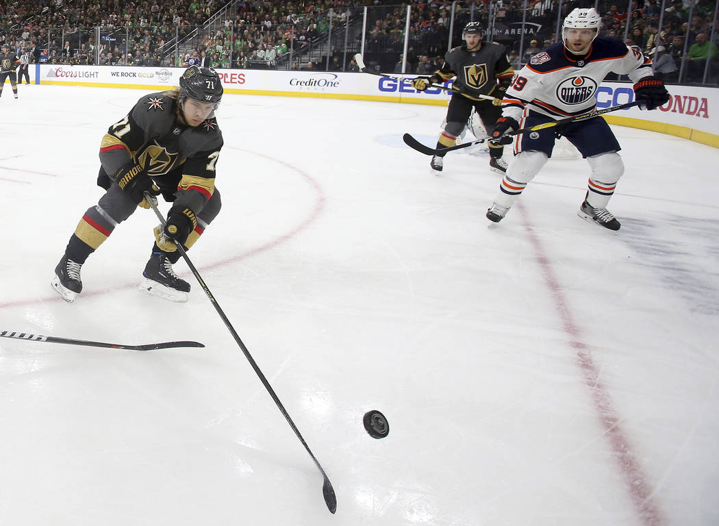 Vegas Golden Knights center William Karlsson (71) skates with the puck as Edmonton Oilers right wing Alex Chiasson defends during the first period of an NHL hockey game Sunday, March 17, 2019, in ...