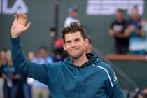 Dominic Thiem, of Austria, waves after defeating Roger Federer, of Switzerland, in the men's final at the BNP Paribas Open tennis tournament Sunday, March 17, 2019, in Indian Wells, Calif. Thiem w ...