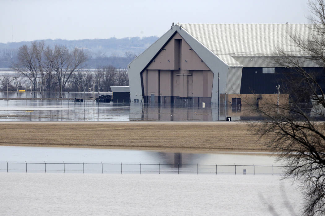 A hangar at Offutt Air Force Base in Bellevue, Neb., is flooded by waters from the Missouri River, Sunday, March 17, 2019. About a third of the base is flooded, including about 3,000 feet of the b ...