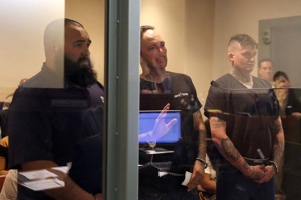Roberto Romero, 30, left, Travis Callahan, 35, and Matthew Norris, 34, appear in court at the Regional Justice Center on Monday, March. 18, 2019, in Las Vegas. The three face several charges after ...
