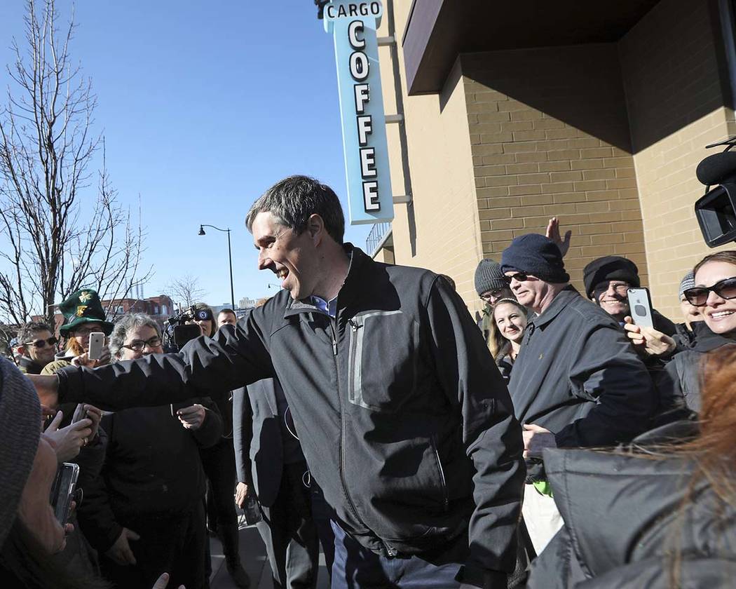 Democratic presidential candidate Beto O'Rourke greets a crowd outside Cargo Coffee on East Washington Avenue during a stop in Madison, Wis., Sunday, March 17, 2019. (AP Photo/Wisconsin State Jour ...