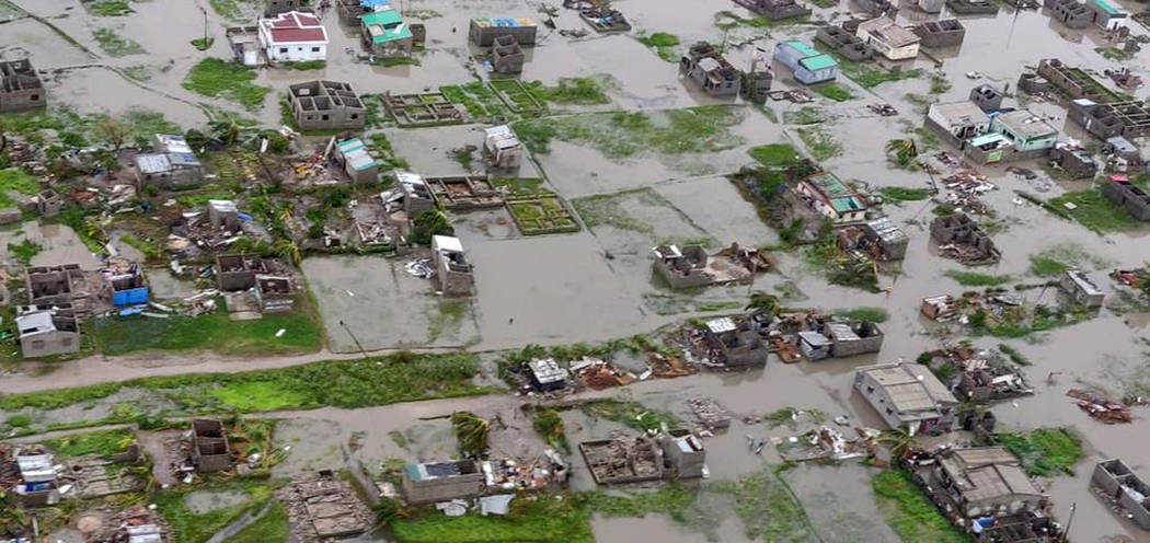 This image made available by International Federation of Red Cross and Red Crescent Societies (IFRC) on Monday March 18, 2019, shows an aerial view from a helicopter of flooding in Beira, Mozambiq ...