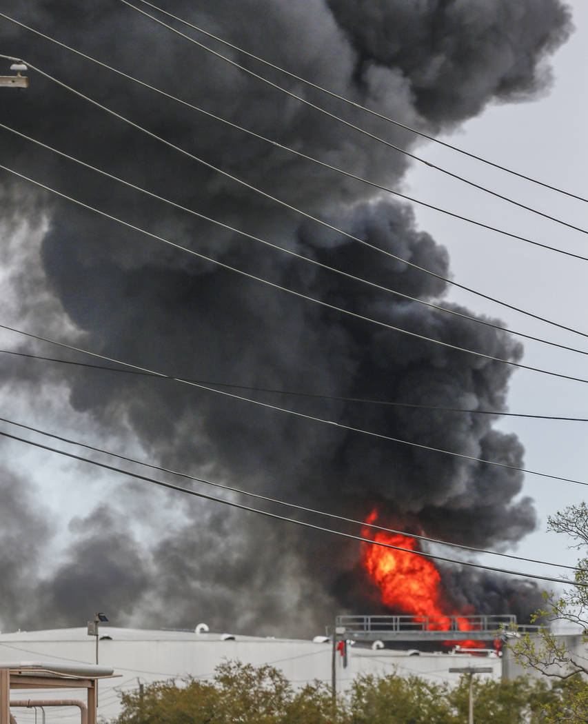 Smoke rises from a fire burning at the Intercontinental Terminals Company in Deer Park, east of Houston, Sunday, March 17, 2019. Some residents in the area are being urged to find a safe location ...