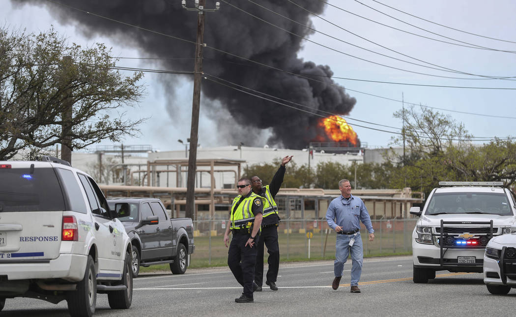 Smoke rises from a fire burning at the Intercontinental Terminals Company in Deer Park, east of Houston, Sunday, March 17, 2019. Some residents in the area are being urged to find a safe location ...