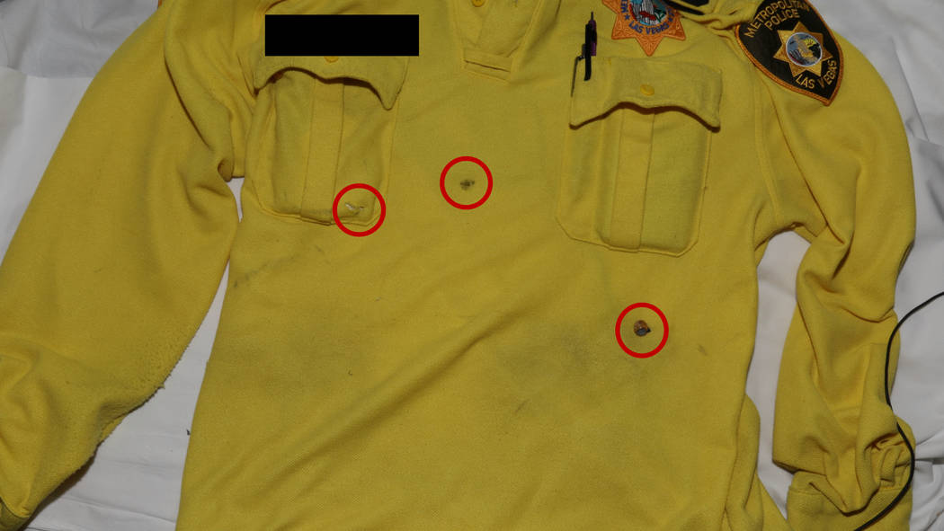 This photo released by the Las Vegas Metropolitan Police Department shows the shirt worn by a Las Vegas police officer who was shot following an armed robbery at the Bellagio hotel-casino on March ...