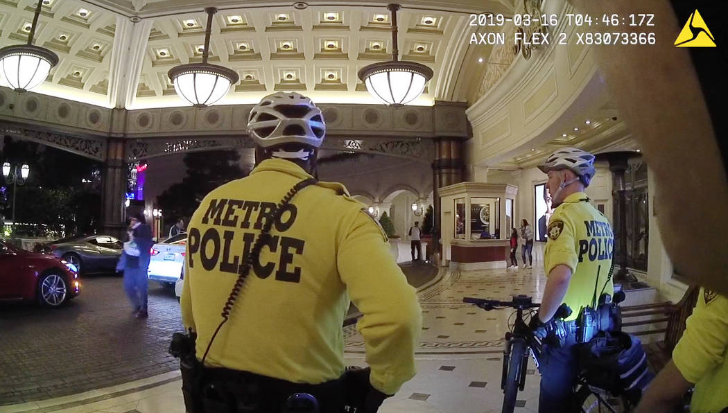 Michael Cohen, left, walks past Las Vegas Metropolitan Police Department officers following an armed robbery at the Bellagio hotel-casino on March 15, 2019. Cohen was shot to death by police follo ...