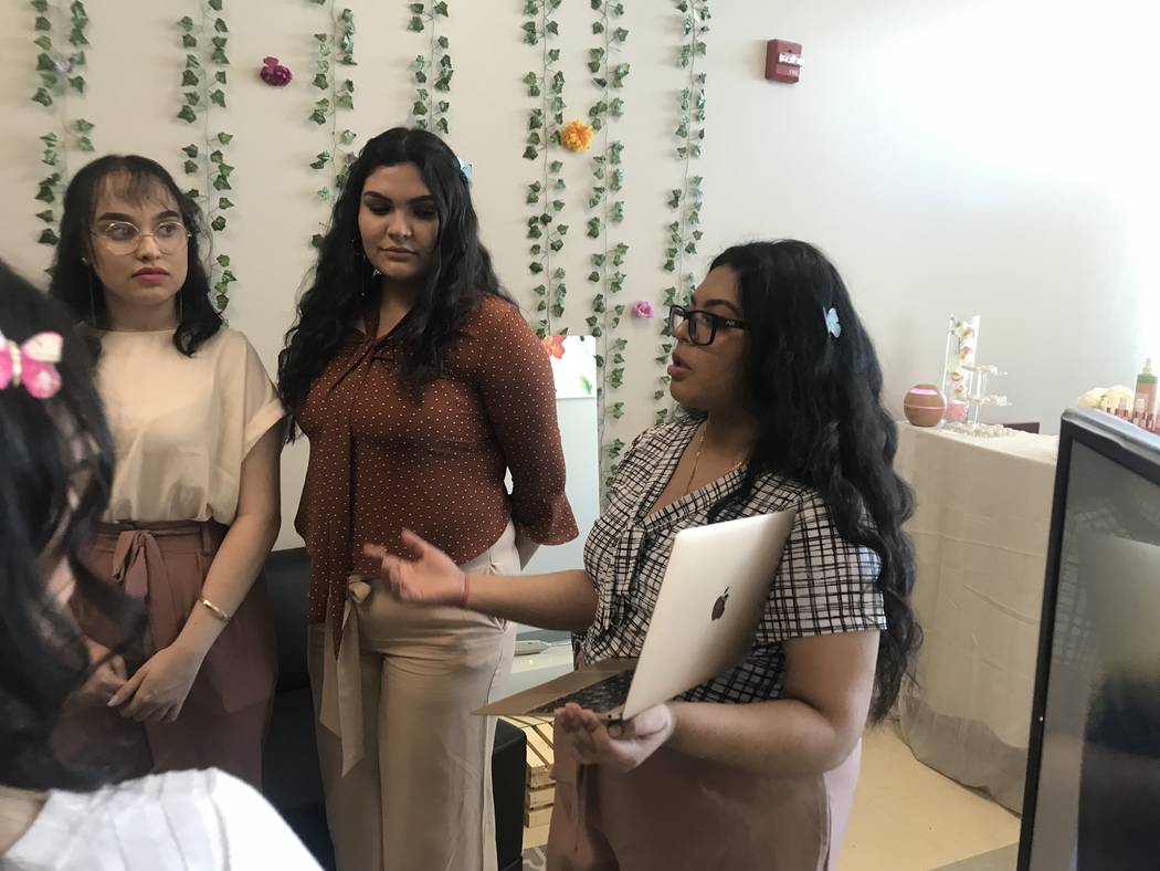 From left, Dyanna Montemayor, Bryanna Grijalva, and Erika Mato inform a group of students about their company, Serenity, during the presenting of Capstone projects at the East Career and Technica ...
