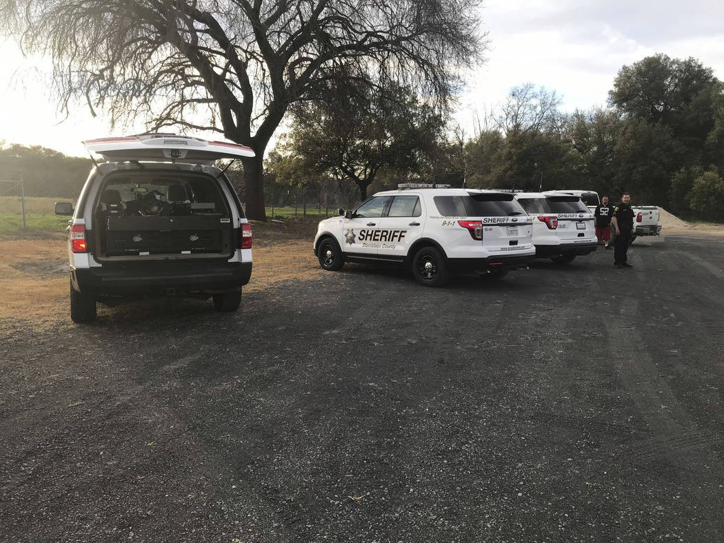 In this Sunday, March 17, 2019 photo provided by the Stanislaus Consolidated Fire Protection District Authorities fire and rescue personnel search for a 5-year-old girl who was swept away by a swo ...