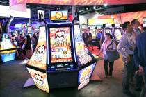 People gather in the Aristocrat booth during the Global Gaming Expo at the Las Vegas Sands Expo and Convention Center on Thursday, Sept. 29, 2016. (Las Vegas Review-Journal/File)