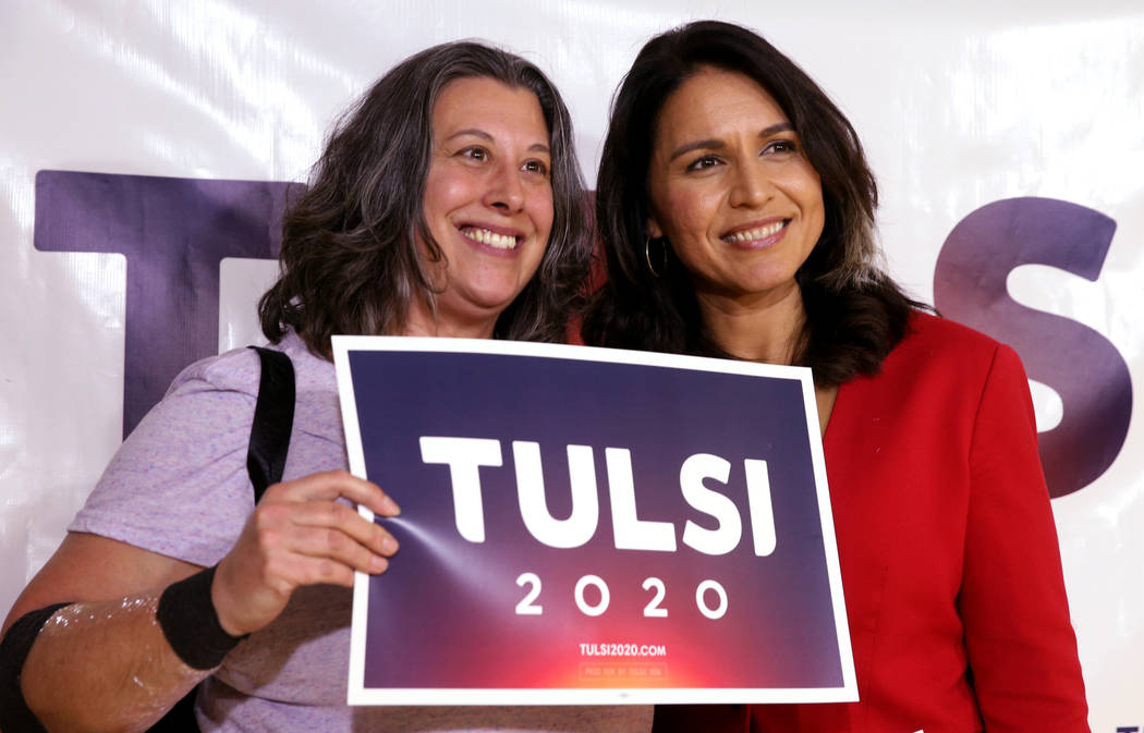 Presidential hopeful U.S. Rep. Tulsi Gabbard, D-Hawaii, right, with Shelly O'Connor of Las Vegas during a meet and greet at the Asian Culture Center in downtown Las Vegas Monday, March 18, 2019. ( ...