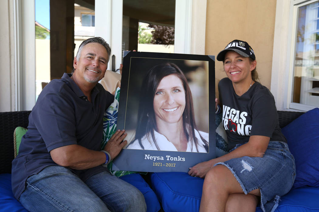 Chris Davis, father of Route 91 Harvest festival shooting victim Neysa Tonks, and his daughter Mynda Smith pose with a photograph of Tonks on Sept. 26, 2018, in Las Vegas. (Bizuayehu Tesfaye/Las V ...