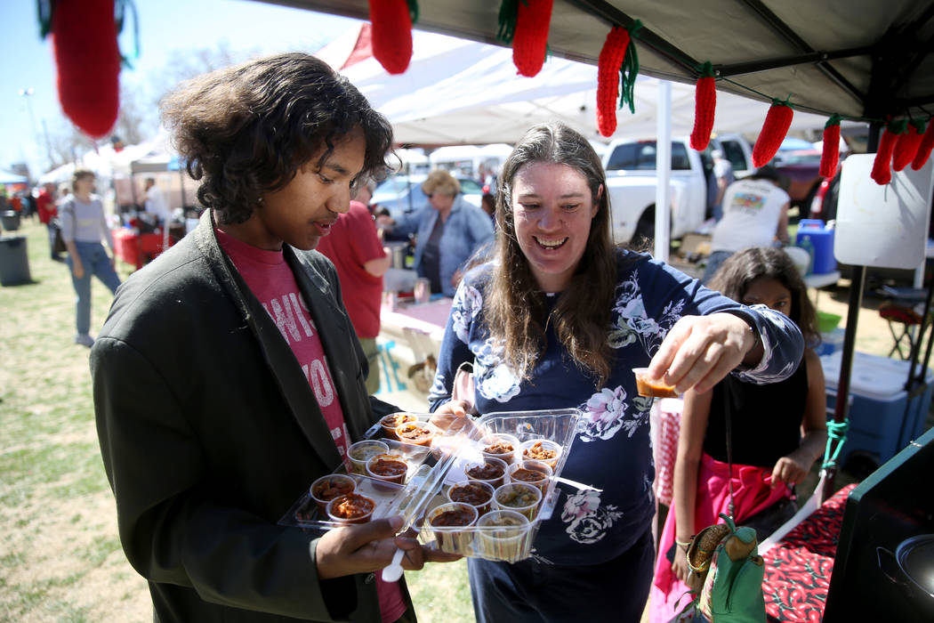 Heather Rooks and her children Khacha Rooks, 16, and Rilah Rooks, 11, of Pahrump, gather People's Choice samples during the Nevada State Chili Cook-off at Petrack Park in Pahrump Sunday, March 17, ...