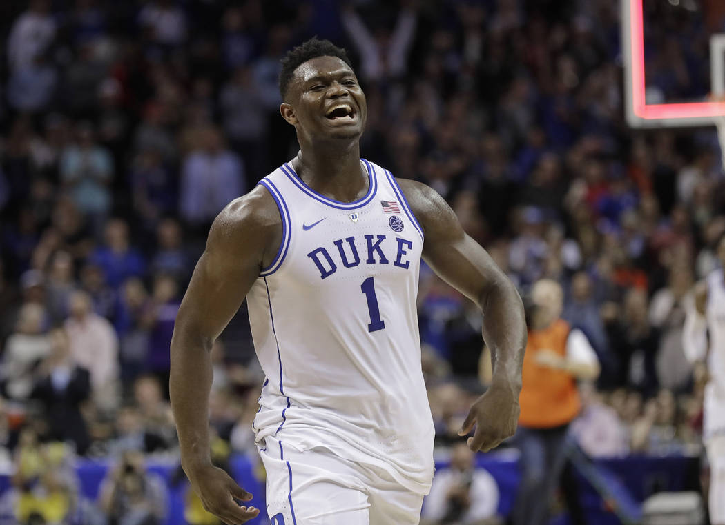 Duke's Zion Williamson (1) celebrates after Duke defeated Florida State in the NCAA college basketball championship game of the Atlantic Coast Conference tournament in Charlotte, N.C., Saturday, M ...