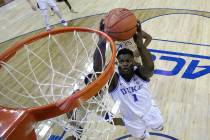Duke's Zion Williamson (1) goes up to dunk against Florida State during the first half of the NCAA college basketball championship game of the Atlantic Coast Conference tournament in Charlotte, N. ...